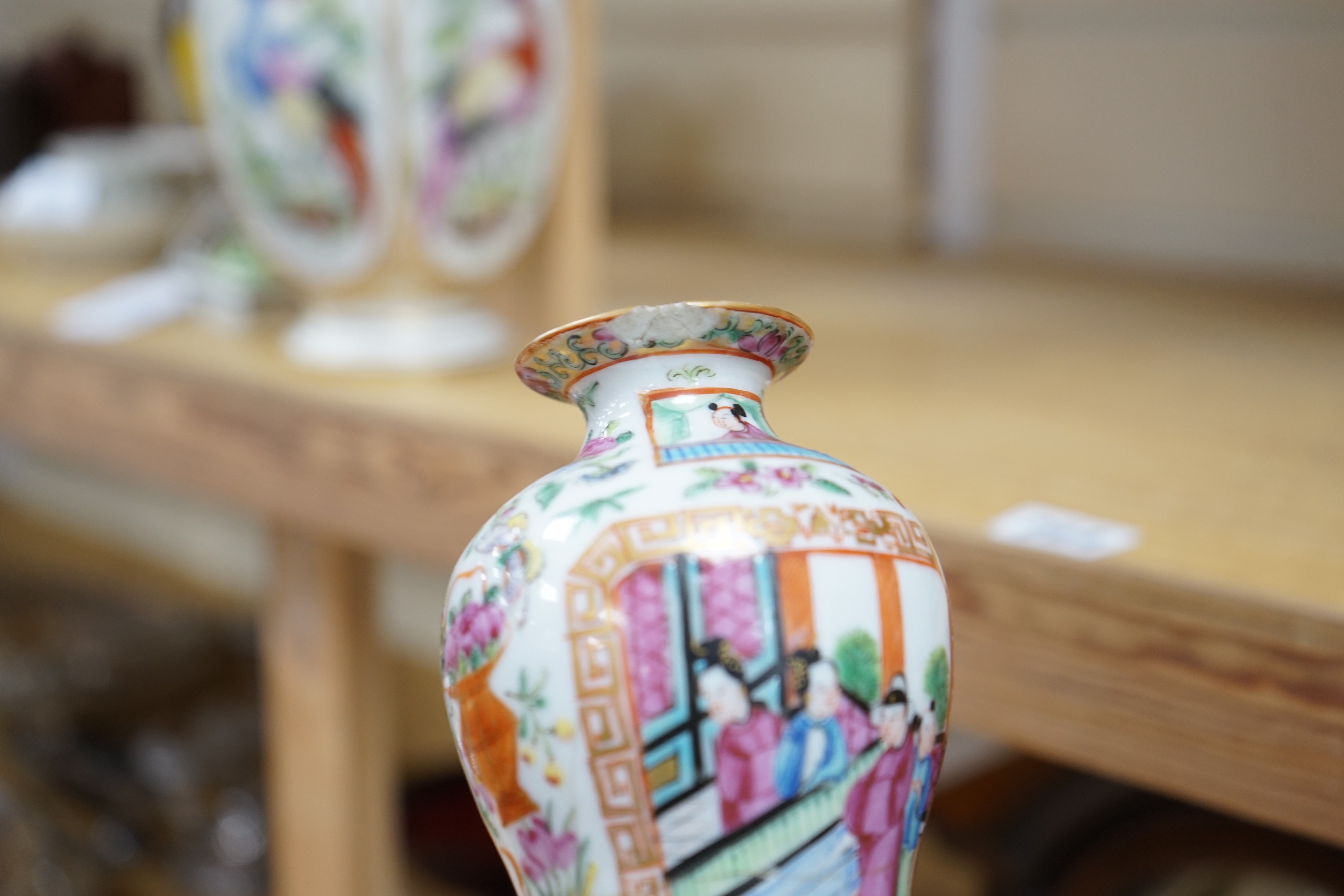 Three Chinese famille rose vases and a teapot, late 19th/early 20th century, tallest vase 29.5 cms high